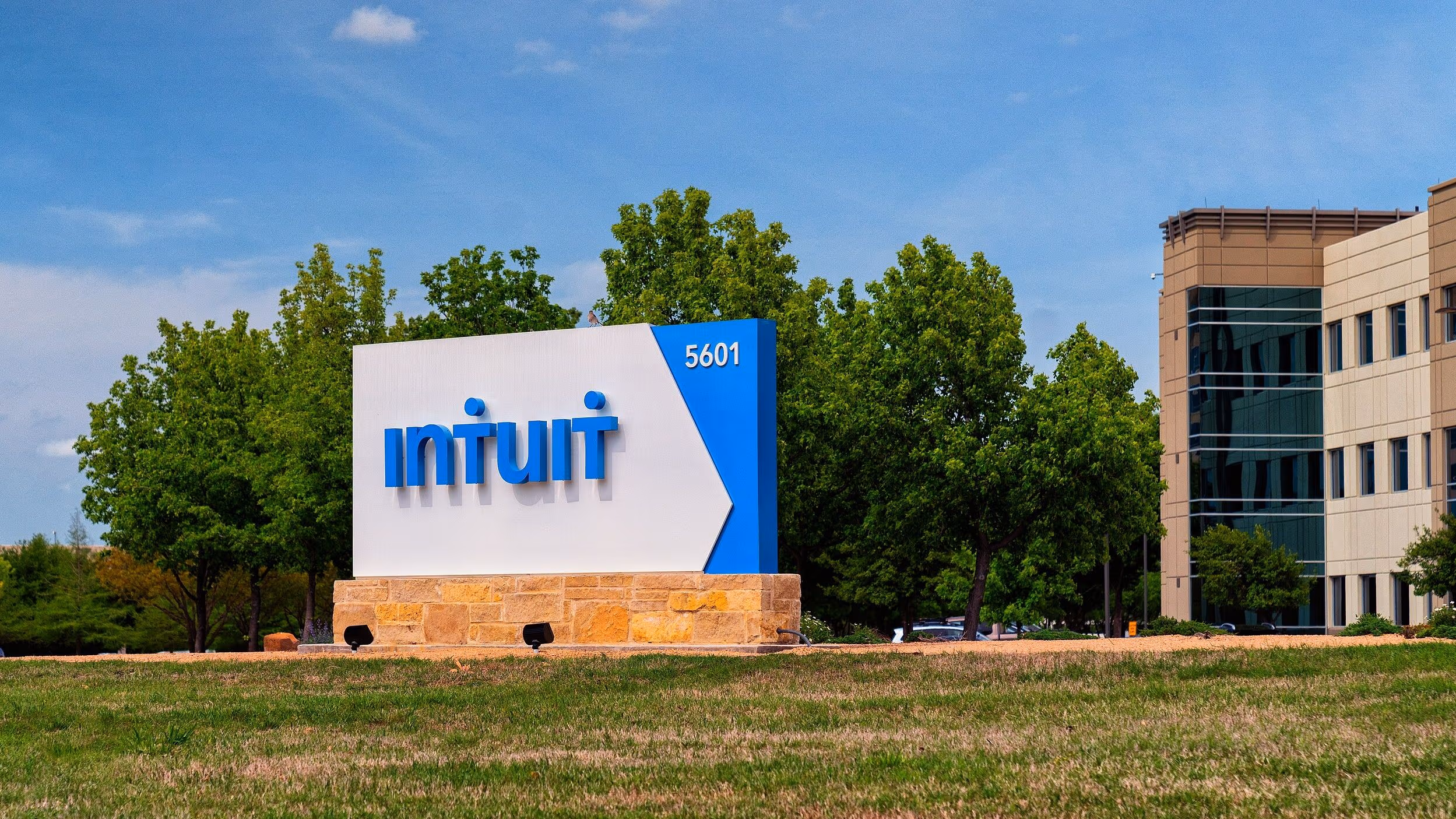 The Intuit logo is located on the grass next to the software maker's headquarters building.